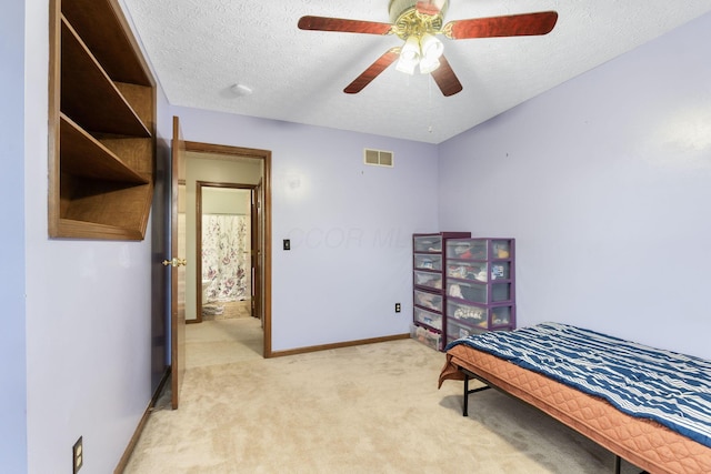 2257 Jarrow Dr, Hilliard, OH 43026 - bedroom with light carpet, baseboards, a textured ceiling, and a ceiling fan