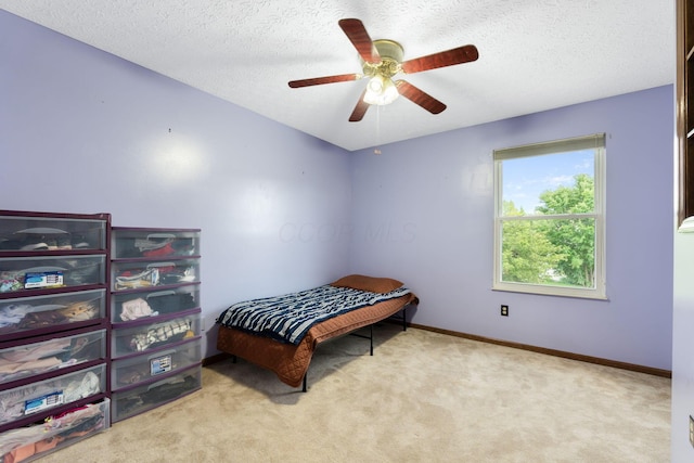 2257 Jarrow Dr, Hilliard, OH 43026 - bedroom with carpet flooring, a textured ceiling, baseboards, and a ceiling fan