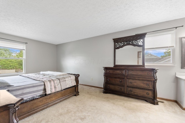 2257 Jarrow Dr, Hilliard, OH 43026 - bedroom featuring light carpet, baseboards, and a textured ceiling
