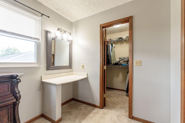 2257 Jarrow Dr, Hilliard, OH 43026 - bathroom with a textured ceiling, baseboards, and a walk in closet