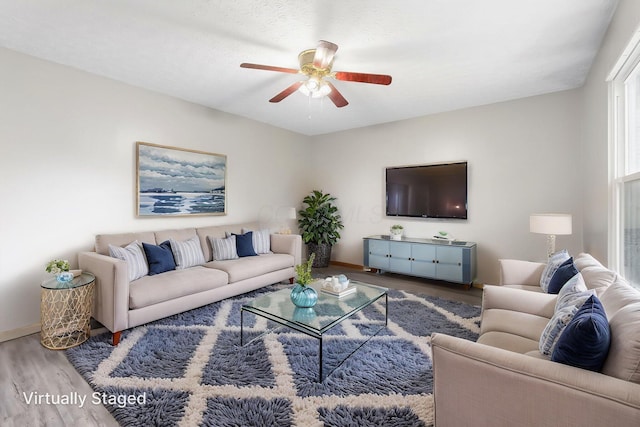 2257 Jarrow Dr, Hilliard, OH 43026 - living area featuring wood finished floors, a ceiling fan, and baseboards