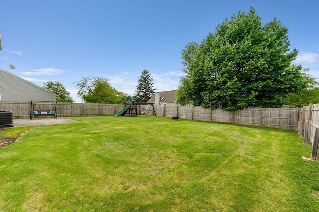 2257 Jarrow Dr, Hilliard, OH 43026 - view of yard featuring a playground and central AC