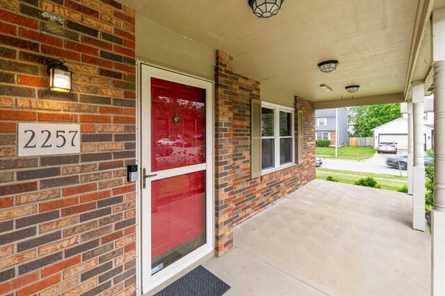 2257 Jarrow Dr, Hilliard, OH 43026 - doorway to property with a porch and brick siding