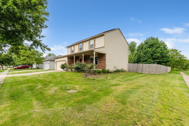 2257 Jarrow Dr, Hilliard, OH 43026 - traditional-style house featuring a garage, driveway, and brick siding