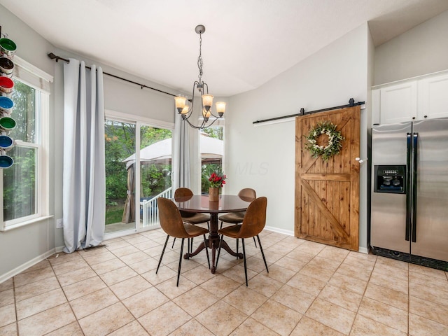 dining space with baseboards, a notable chandelier, a barn door, and light tile patterned floors