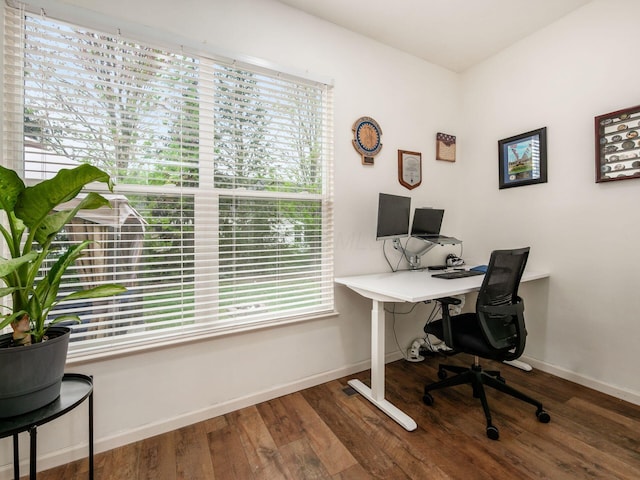 home office featuring baseboards and wood finished floors
