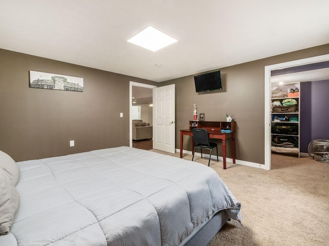 bedroom with baseboards and carpet