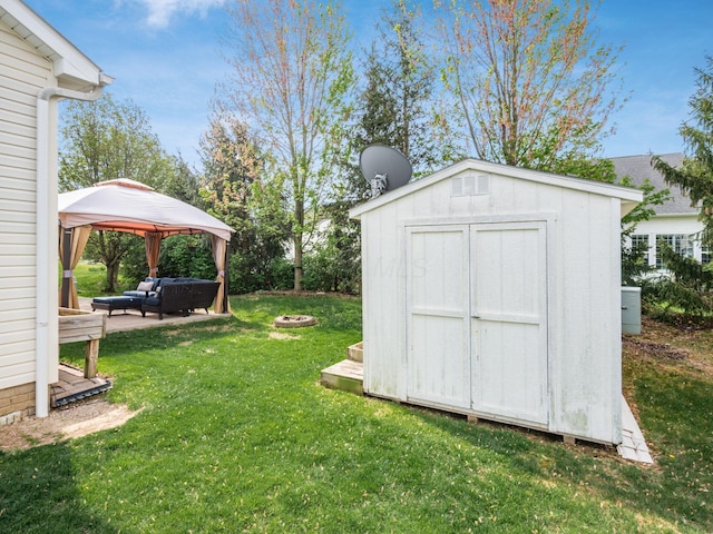 view of shed with a gazebo and an outdoor hangout area