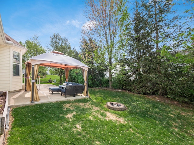 view of yard featuring an outdoor living space with a fire pit, a patio, and a gazebo