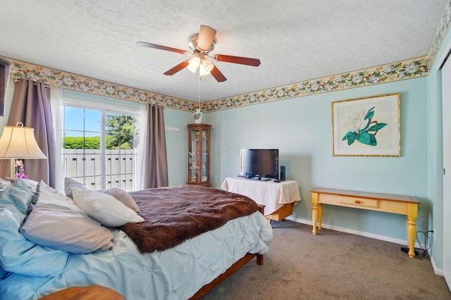 carpeted bedroom featuring access to outside, a textured ceiling, ceiling fan, and baseboards