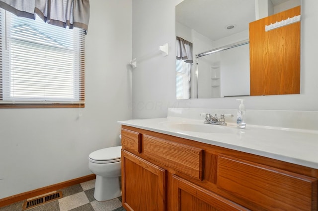 full bathroom with visible vents, an enclosed shower, baseboards, vanity, and toilet