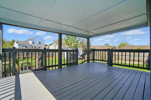 wooden terrace with a residential view