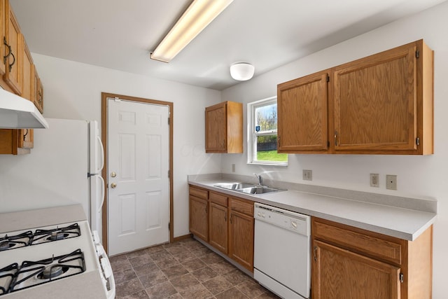 611 Sackman St, Mansfield, OH 44903 - kitchen featuring brown cabinetry, white appliances, light countertops, under cabinet range hood, and a sink