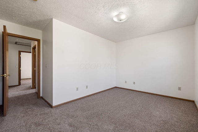 611 Sackman St, Mansfield, OH 44903 - spare room with baseboards, carpet flooring, and a textured ceiling