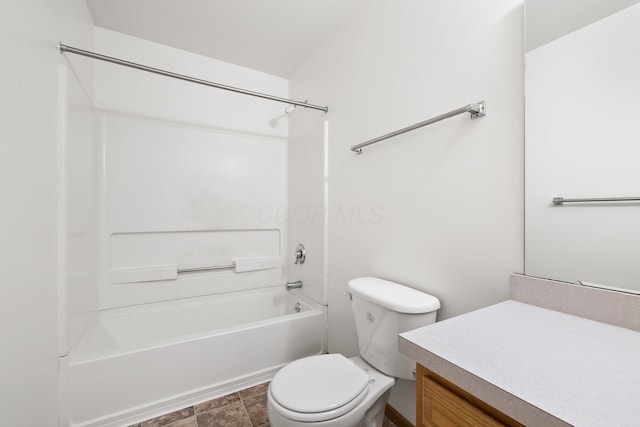 611 Sackman St, Mansfield, OH 44903 - bathroom featuring vanity, stone finish floor, toilet, and tub / shower combination