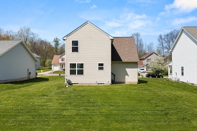 611 Sackman St, Mansfield, OH 44903 - back of house featuring a lawn and a shingled roof