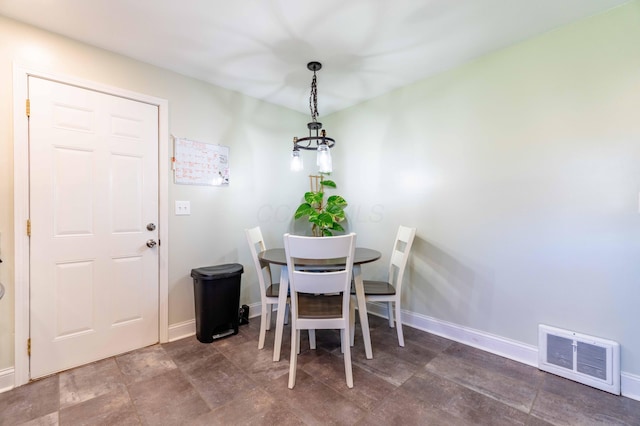 dining area featuring baseboards and visible vents
