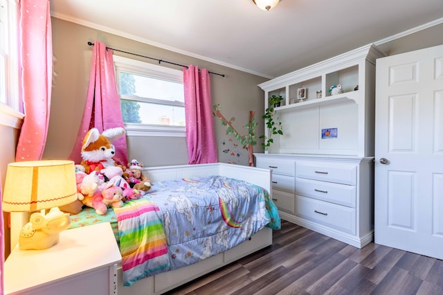 bedroom featuring crown molding and dark wood-style floors