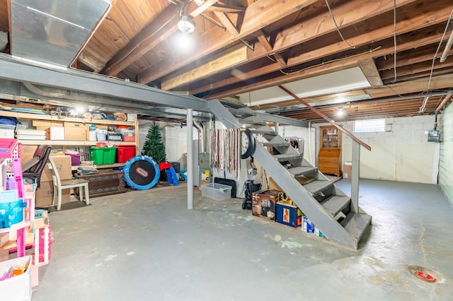 basement featuring stairs