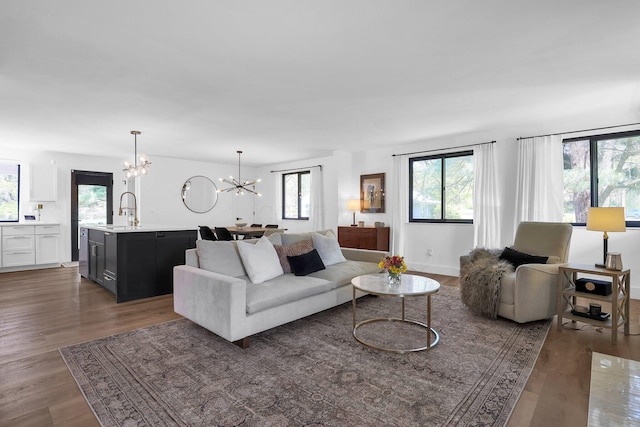 5300 Clark State Rd, Columbus, OH 43230 - living room featuring an inviting chandelier, wood finished floors, and a wealth of natural light