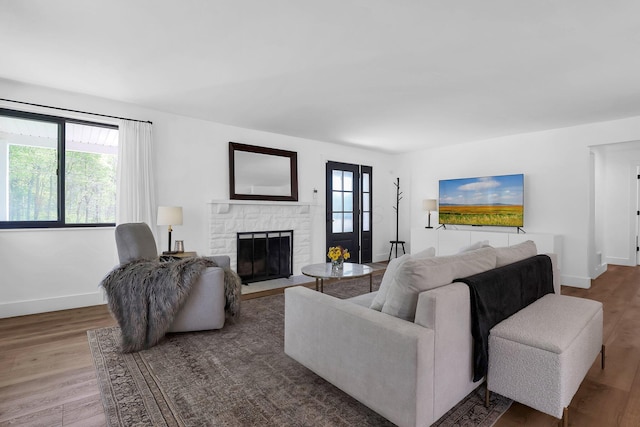 5300 Clark State Rd, Columbus, OH 43230 - living area with baseboards, a stone fireplace, and wood finished floors