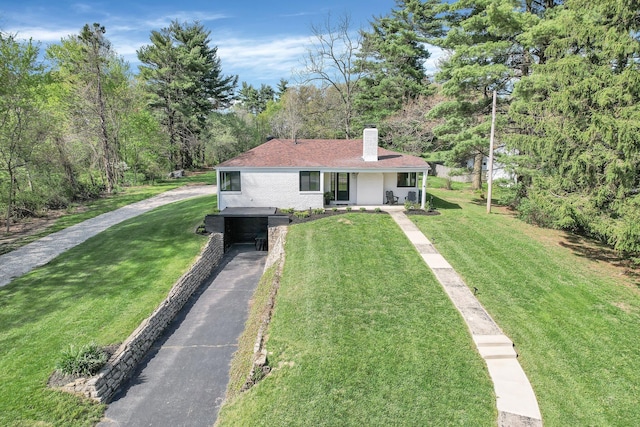 5300 Clark State Rd, Columbus, OH 43230 - view of front facade featuring a porch, a chimney, driveway, and a front yard