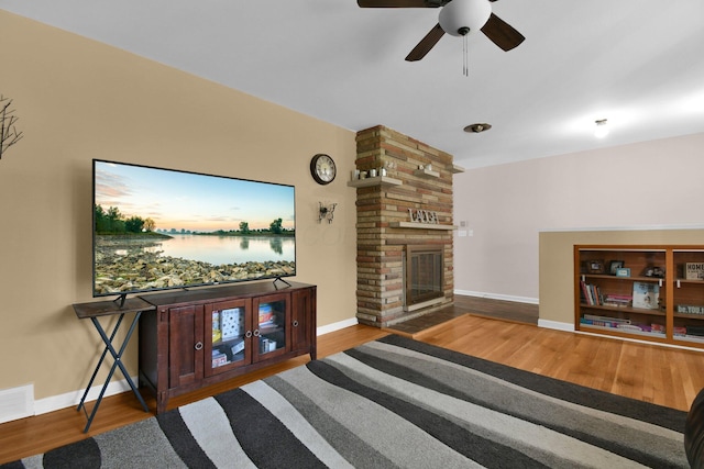 895 Janet Dr, Columbus, OH 43224 - living room with a ceiling fan, baseboards, wood finished floors, and a fireplace