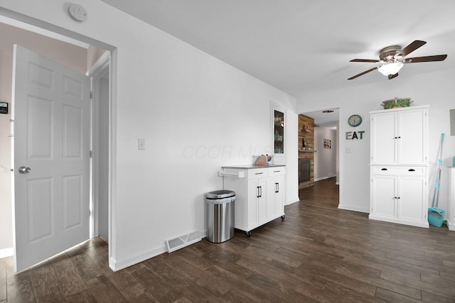 895 Janet Dr, Columbus, OH 43224 - interior space featuring visible vents, dark wood-style flooring, ceiling fan, and baseboards