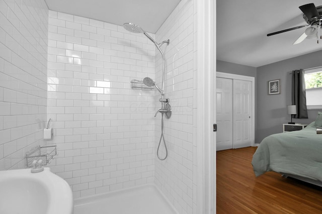 895 Janet Dr, Columbus, OH 43224 - full bath with ceiling fan, wood finished floors, and a tile shower