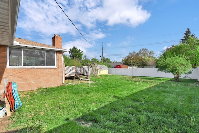 895 Janet Dr, Columbus, OH 43224 - view of yard featuring fence and a deck