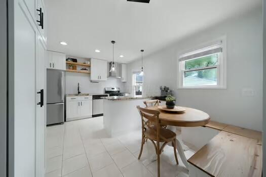 233 Girard Rd, Columbus, OH 43214 - dining room featuring recessed lighting and light tile patterned floors