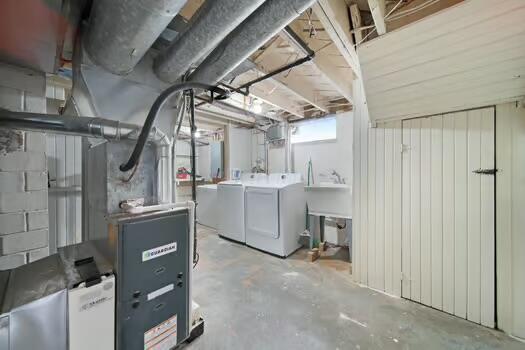 233 Girard Rd, Columbus, OH 43214 - below grade area featuring washing machine and clothes dryer