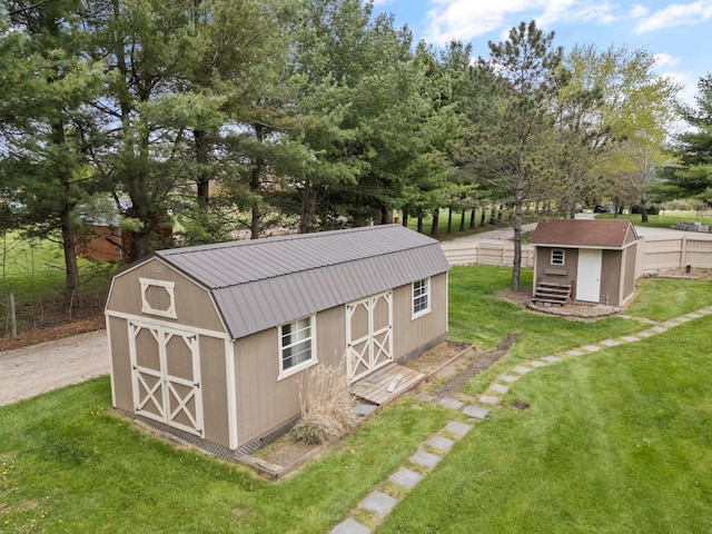 view of shed featuring fence