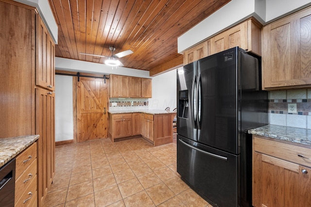 kitchen with backsplash, a barn door, wood ceiling, and black appliances