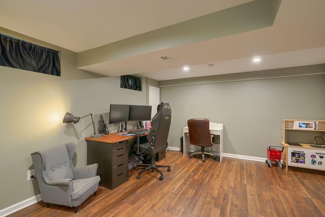 home office with baseboards, recessed lighting, wood finished floors, and visible vents