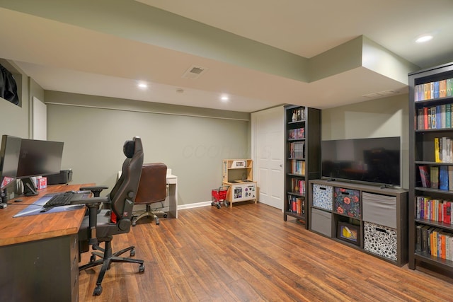 home office featuring recessed lighting, baseboards, visible vents, and wood finished floors