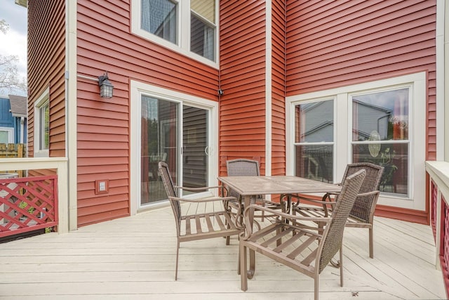 deck featuring outdoor dining area