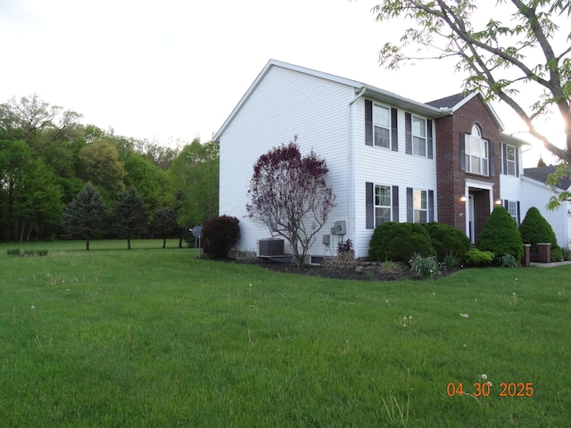 view of property exterior with a yard