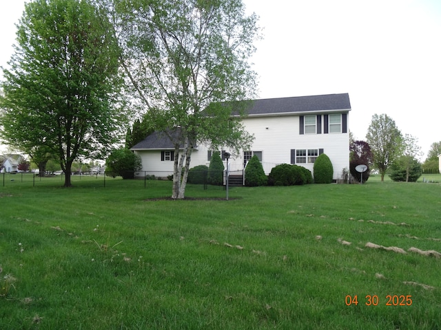 exterior space featuring a yard and fence
