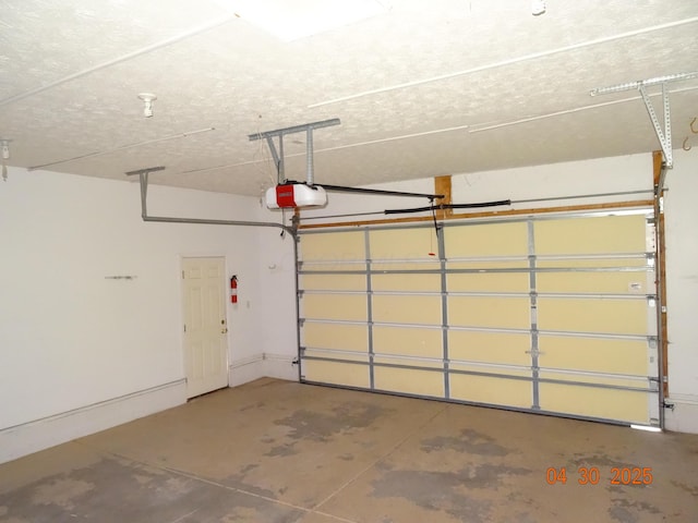 garage featuring a garage door opener