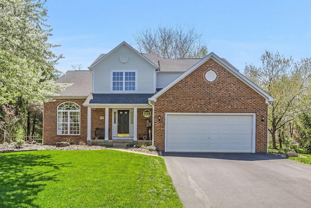 traditional home with roof with shingles, a front lawn, brick siding, a garage, and aphalt driveway