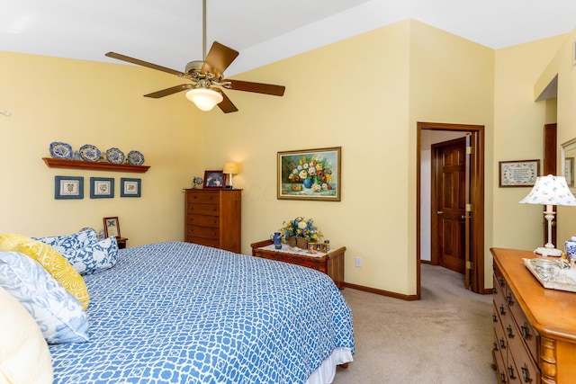 bedroom featuring baseboards, light carpet, and a ceiling fan