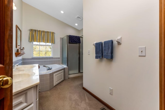 full bathroom featuring visible vents, a garden tub, lofted ceiling, baseboards, and a shower stall