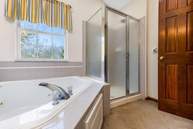 full bath with a jetted tub and a stall shower