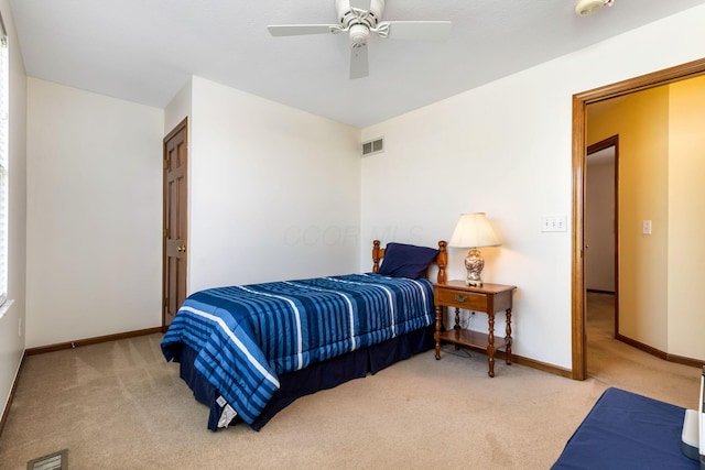 bedroom featuring baseboards, a ceiling fan, carpet flooring, and visible vents