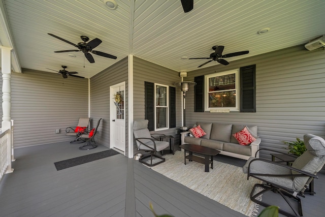 wooden deck featuring ceiling fan and an outdoor hangout area