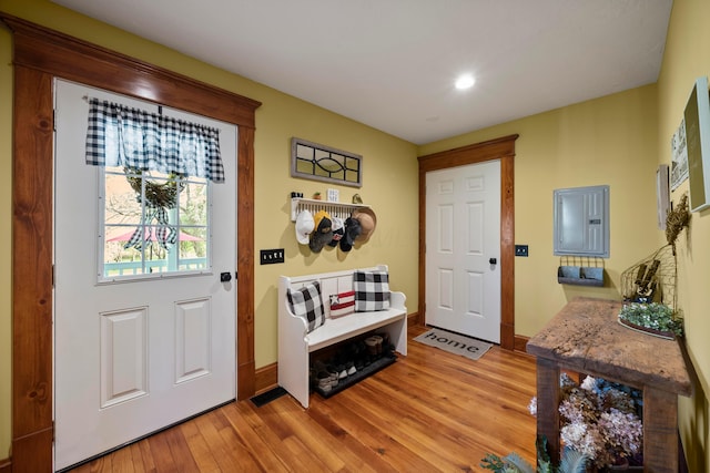 entrance foyer with baseboards, recessed lighting, light wood-style flooring, and electric panel