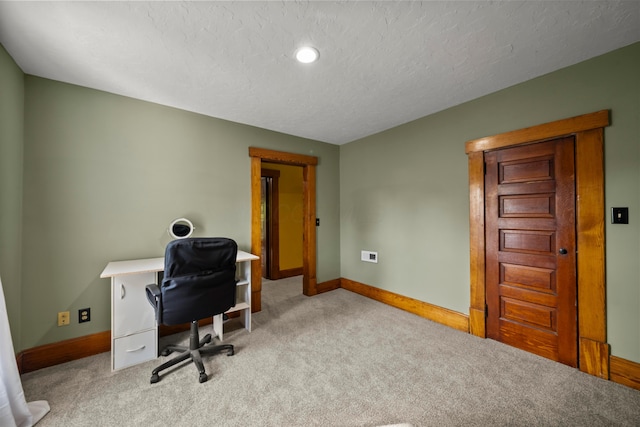 carpeted home office with a textured ceiling, baseboards, and recessed lighting