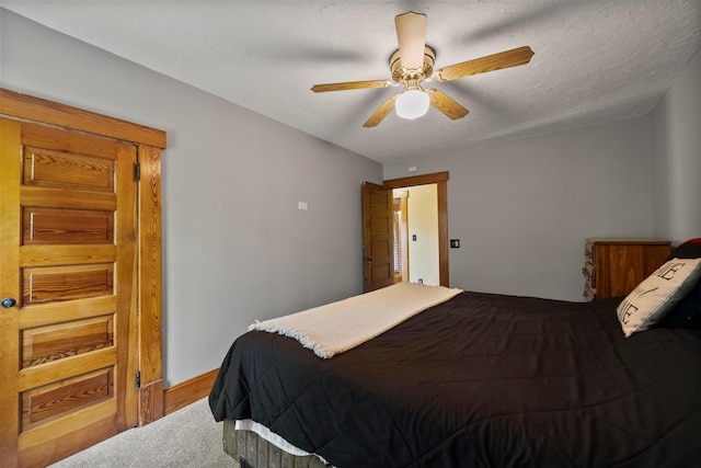 carpeted bedroom with a ceiling fan