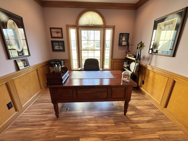 office area featuring crown molding, wainscoting, and light wood-style flooring